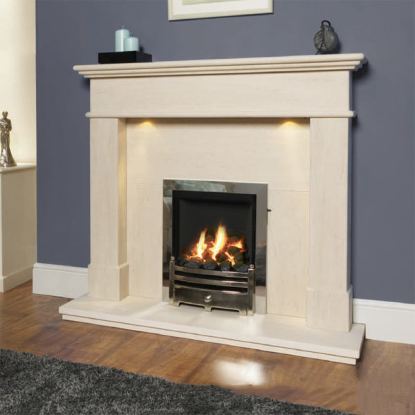 Barcelo Limestone fireplace with added downlights shown with an inset gas fire finished in chrome with a coal fuel bed