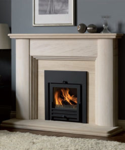 Villamoura Limestone fireplace with an inset solid fuel basket