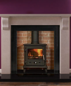 Corbel marble fire surround in an Italian Verona Grey marble shown with a wood burning stove and polished granite slips